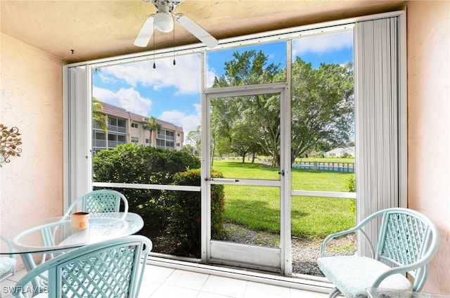 100 Forest Lakes Blvd Unit 110, Naples, FL 34105 - sunroom featuring ceiling fan and plenty of natural light