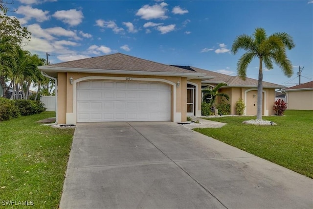 605 SE 22nd St, Cape Coral, FL 33990 - ranch-style home with a front yard, an attached garage, driveway, and stucco siding