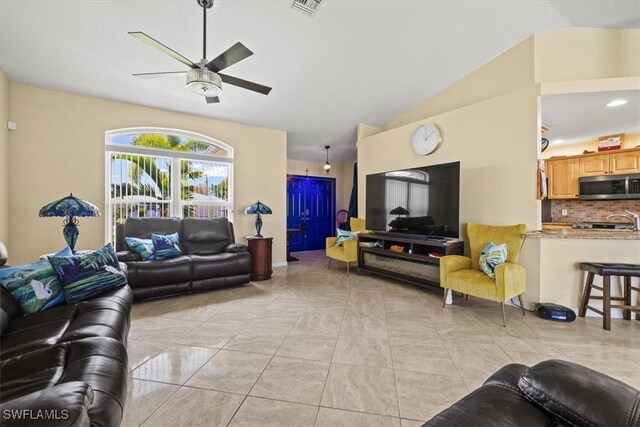 605 SE 22nd St, Cape Coral, FL 33990 - living area with visible vents, a ceiling fan, light tile patterned floors, and lofted ceiling