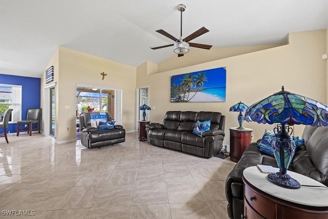 605 SE 22nd St, Cape Coral, FL 33990 - living room featuring baseboards, a ceiling fan, and lofted ceiling