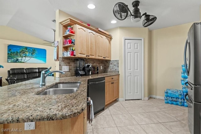 605 SE 22nd St, Cape Coral, FL 33990 - kitchen with dishwasher, a sink, freestanding refrigerator, a peninsula, and stone countertops
