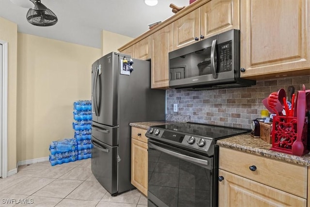 605 SE 22nd St, Cape Coral, FL 33990 - kitchen featuring tasteful backsplash, light tile patterned floors, light brown cabinetry, and stainless steel appliances