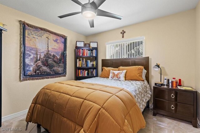 605 SE 22nd St, Cape Coral, FL 33990 - bedroom with ceiling fan, baseboards, and light tile patterned floors