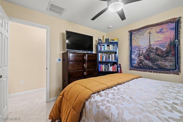 605 SE 22nd St, Cape Coral, FL 33990 - tiled bedroom featuring visible vents, baseboards, and ceiling fan