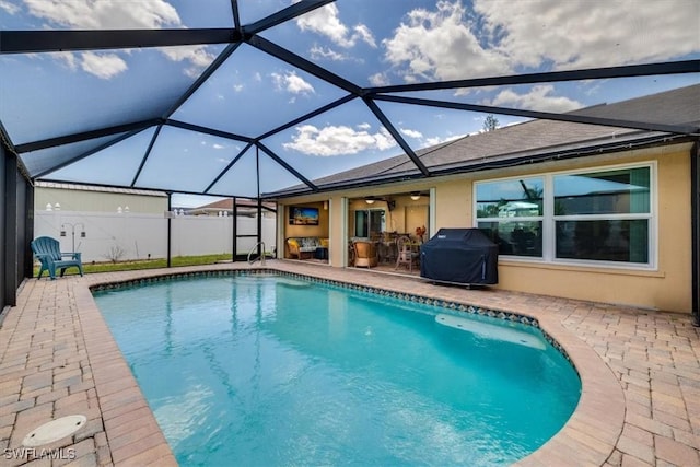 605 SE 22nd St, Cape Coral, FL 33990 - pool featuring a ceiling fan, grilling area, a patio area, fence, and a lanai
