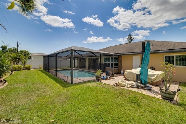 605 SE 22nd St, Cape Coral, FL 33990 - rear view of property with a fenced in pool, a patio, a fenced backyard, glass enclosure, and a lawn