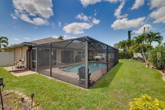 605 SE 22nd St, Cape Coral, FL 33990 - view of pool with a patio, a yard, and fence