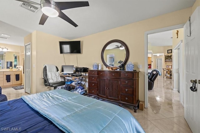 605 SE 22nd St, Cape Coral, FL 33990 - bedroom with visible vents, ensuite bathroom, a ceiling fan, and light tile patterned flooring