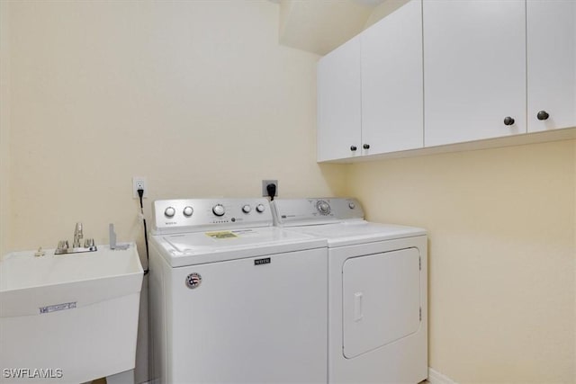 605 SE 22nd St, Cape Coral, FL 33990 - washroom with washer and dryer, a sink, and cabinet space