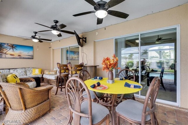 605 SE 22nd St, Cape Coral, FL 33990 - view of patio / terrace featuring outdoor dining space, an outdoor living space, and ceiling fan