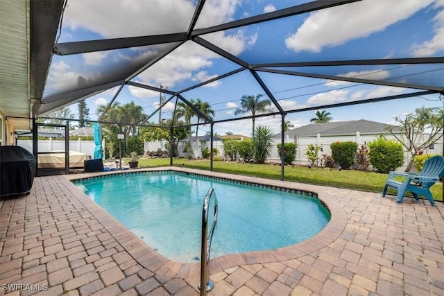 605 SE 22nd St, Cape Coral, FL 33990 - view of pool with a fenced in pool, a patio area, a fenced backyard, and glass enclosure