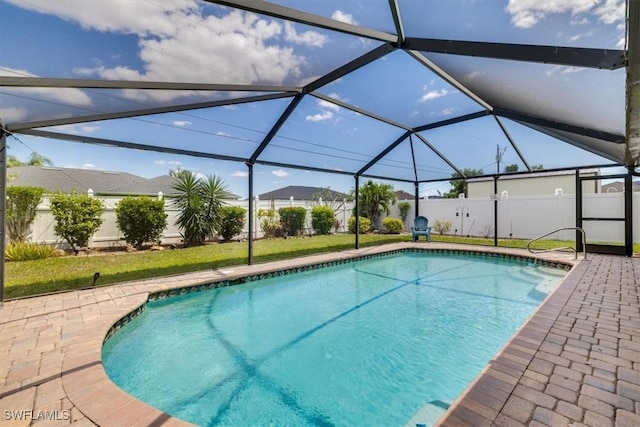 605 SE 22nd St, Cape Coral, FL 33990 - view of swimming pool featuring fence, glass enclosure, a fenced in pool, and a patio