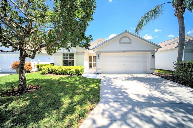 25431 Fairway Dunes Ct, Bonita Springs, FL 34135 - ranch-style house featuring concrete driveway, a front yard, stucco siding, and a garage