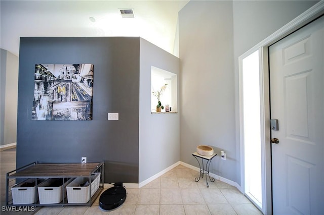 25431 Fairway Dunes Ct, Bonita Springs, FL 34135 - entrance foyer with light tile patterned floors, baseboards, and visible vents