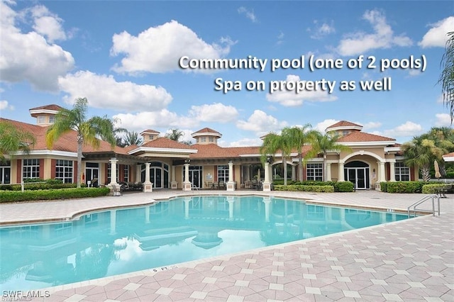 5600 Chelsey Ln Unit 201, Fort Myers, FL 33912 - community pool with a patio