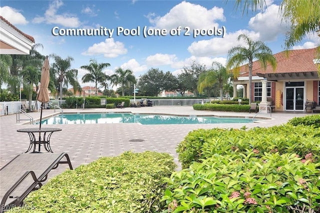 5600 Chelsey Ln Unit 201, Fort Myers, FL 33912 - pool featuring a patio and fence