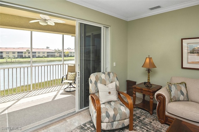 5600 Chelsey Ln Unit 201, Fort Myers, FL 33912 - living area with ornamental molding, a ceiling fan, visible vents, and a water view