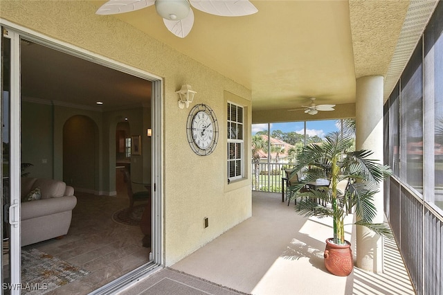 5600 Chelsey Ln Unit 201, Fort Myers, FL 33912 - sunroom / solarium featuring carpet floors, arched walkways, and a textured wall