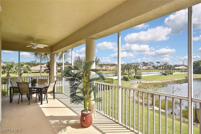 5600 Chelsey Ln Unit 201, Fort Myers, FL 33912 - sunroom featuring a water view and carpet floors