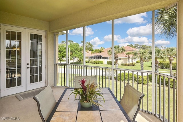 5600 Chelsey Ln Unit 201, Fort Myers, FL 33912 - sunroom / solarium featuring a water view, french doors, and a residential view