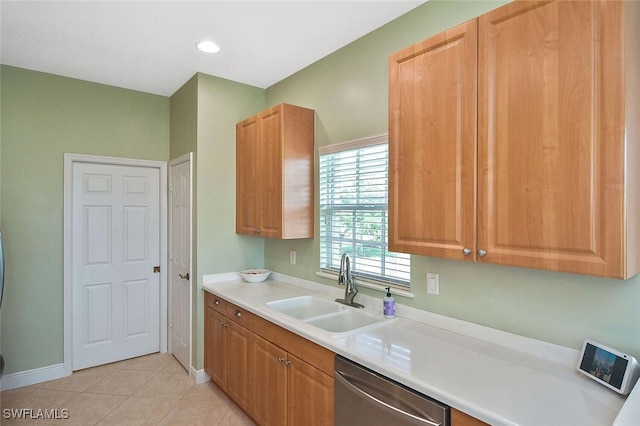 5600 Chelsey Ln Unit 201, Fort Myers, FL 33912 - kitchen with light tile patterned floors, dishwasher, light countertops, a sink, and baseboards
