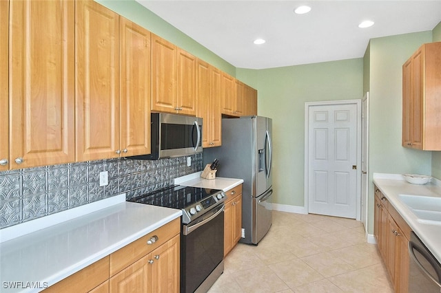 5600 Chelsey Ln Unit 201, Fort Myers, FL 33912 - kitchen featuring tasteful backsplash, recessed lighting, light tile patterned flooring, light countertops, and stainless steel appliances