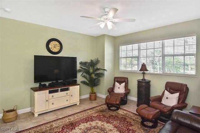 5600 Chelsey Ln Unit 201, Fort Myers, FL 33912 - living room featuring light tile patterned floors, baseboards, and a ceiling fan
