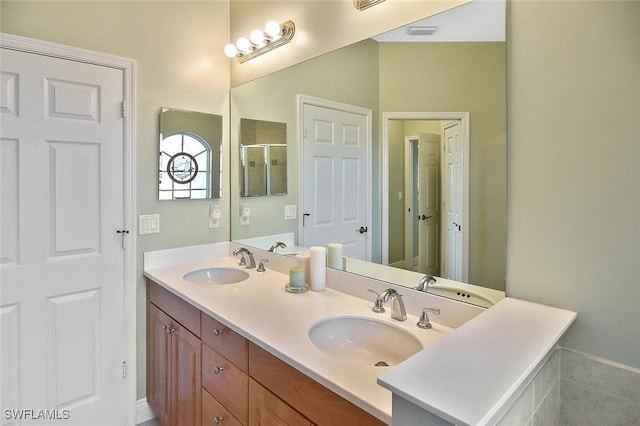 5600 Chelsey Ln Unit 201, Fort Myers, FL 33912 - bathroom featuring double vanity, visible vents, and a sink