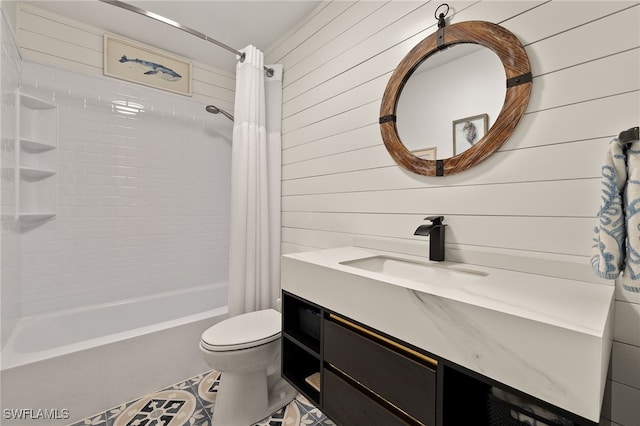 bathroom with wooden walls, tile patterned flooring, shower / tub combo with curtain, vanity, and toilet
