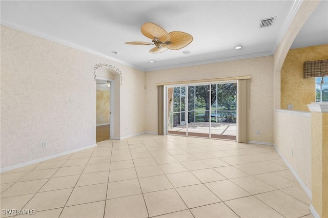 unfurnished room with crown molding, a ceiling fan, and plenty of natural light