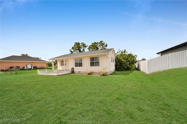 rear view of house featuring crawl space and a patio