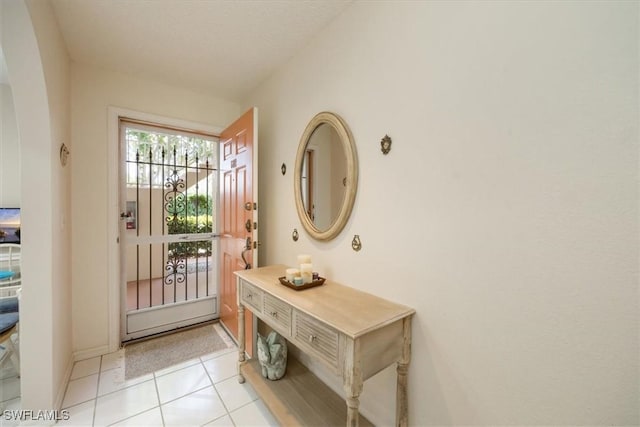 721 Mardel Dr Unit 602, Naples, FL 34104 - doorway to outside with light tile patterned flooring