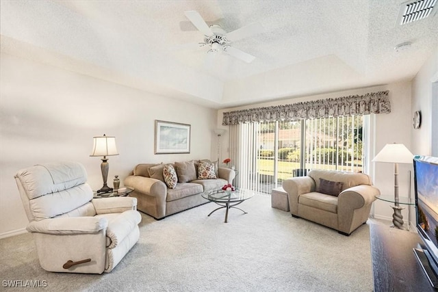 721 Mardel Dr Unit 602, Naples, FL 34104 - living area featuring ceiling fan, carpet, a tray ceiling, a textured ceiling, and visible vents