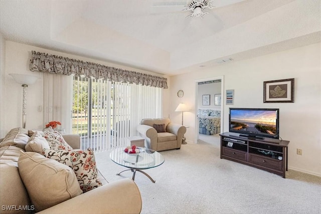 721 Mardel Dr Unit 602, Naples, FL 34104 - carpeted living area featuring baseboards, a ceiling fan, and a raised ceiling