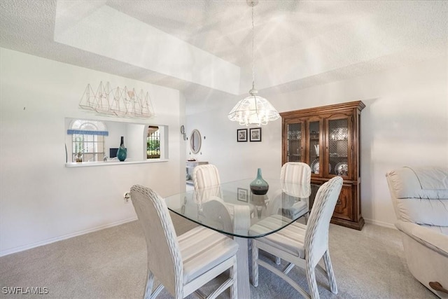 721 Mardel Dr Unit 602, Naples, FL 34104 - dining area featuring a chandelier, light colored carpet, baseboards, and a textured ceiling