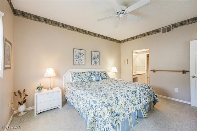 721 Mardel Dr Unit 602, Naples, FL 34104 - bedroom with visible vents, baseboards, carpet flooring, and ensuite bath