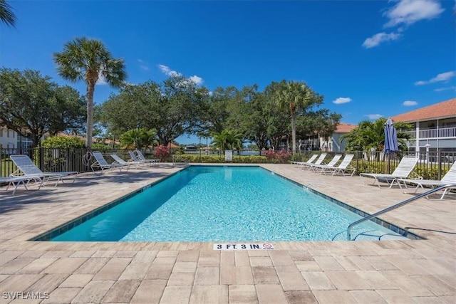 721 Mardel Dr Unit 602, Naples, FL 34104 - community pool with a patio area and fence
