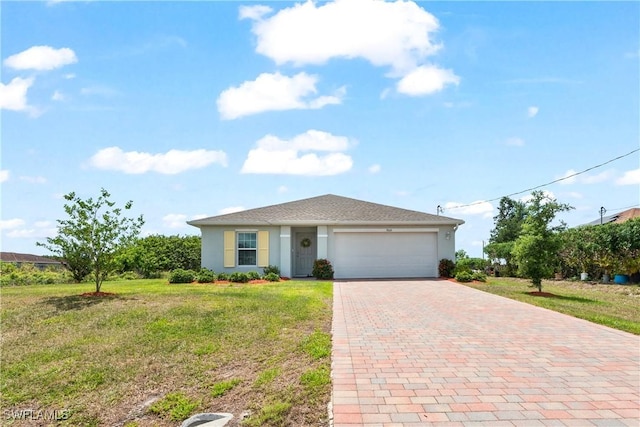 ranch-style home featuring a garage, stucco siding, decorative driveway, and a front lawn