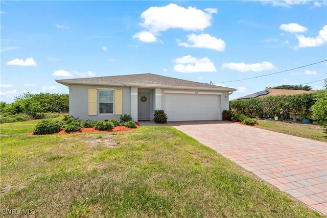 ranch-style house with a front yard, stucco siding, decorative driveway, and an attached garage