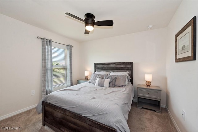 bedroom with baseboards, ceiling fan, and light colored carpet