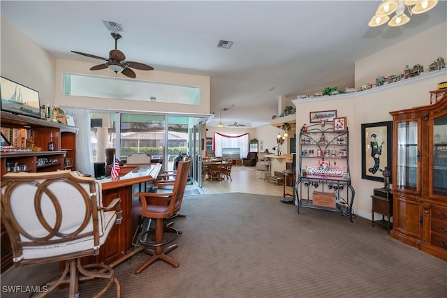 carpeted dining area with visible vents and ceiling fan