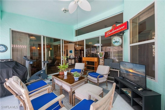 exterior space with visible vents, ceiling fan, and area for grilling