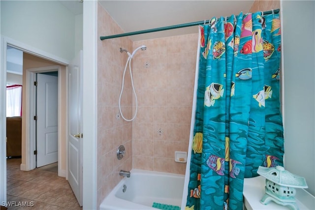 full bath with tile patterned floors and shower / bath combo