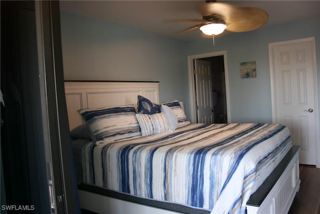 bedroom featuring ceiling fan and dark wood finished floors