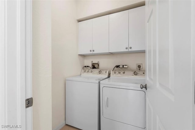 3570 Haldeman Creek Dr Unit 134, Naples, FL 34112 - laundry area with washing machine and clothes dryer and cabinet space