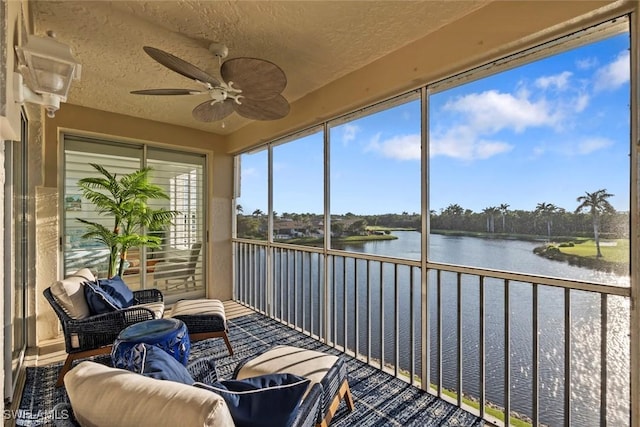 3570 Haldeman Creek Dr Unit 134, Naples, FL 34112 - sunroom / solarium with a water view, a textured ceiling, and a ceiling fan