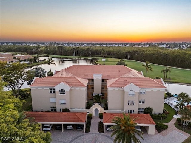 3570 Haldeman Creek Dr Unit 134, Naples, FL 34112 - aerial view at dusk with a water view