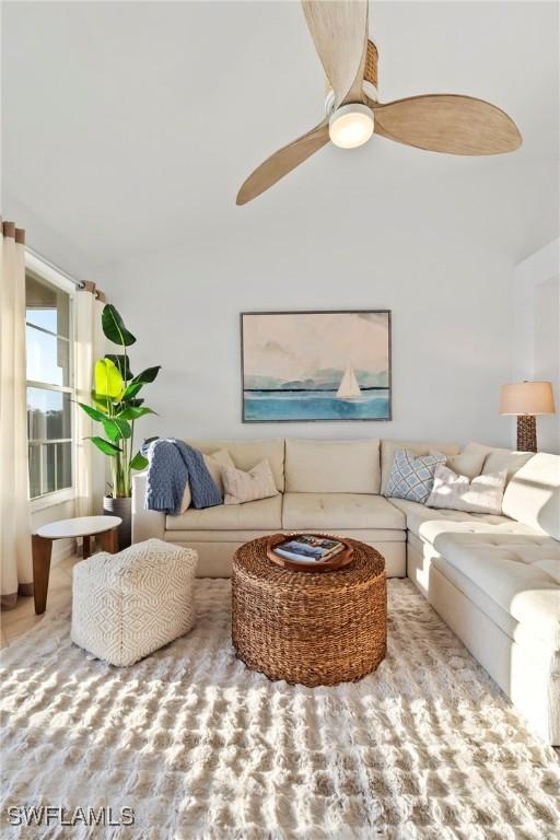 3570 Haldeman Creek Dr Unit 134, Naples, FL 34112 - living room featuring a ceiling fan