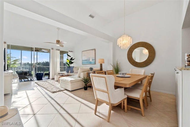 3570 Haldeman Creek Dr Unit 134, Naples, FL 34112 - dining space with baseboards, light tile patterned floors, visible vents, lofted ceiling, and ceiling fan with notable chandelier