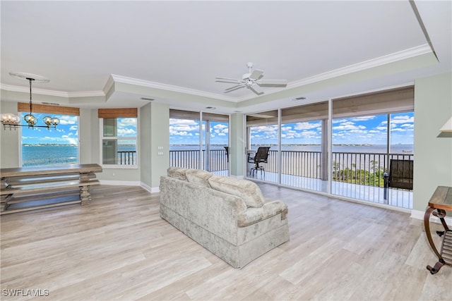 15220 Portside Dr Unit 301, Fort Myers, FL 33908 - living area with ornamental molding, wood finished floors, a tray ceiling, and ceiling fan with notable chandelier